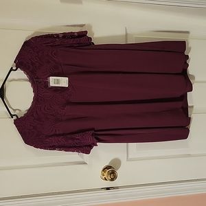 Torrid NEW size 2 purple short sleeved blouse. Lace sleeves with scalloped edge.